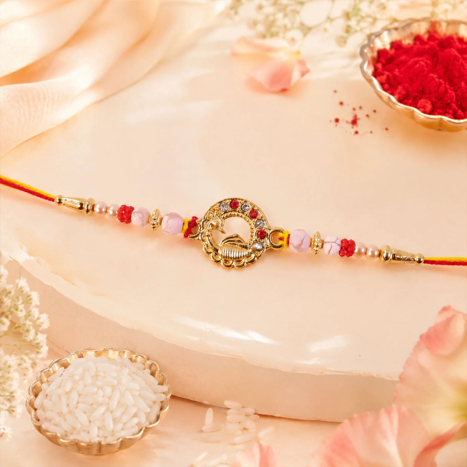 Rakhi – Elegant Antique Golden Peacock with Pearls & Red Beads - Image 2