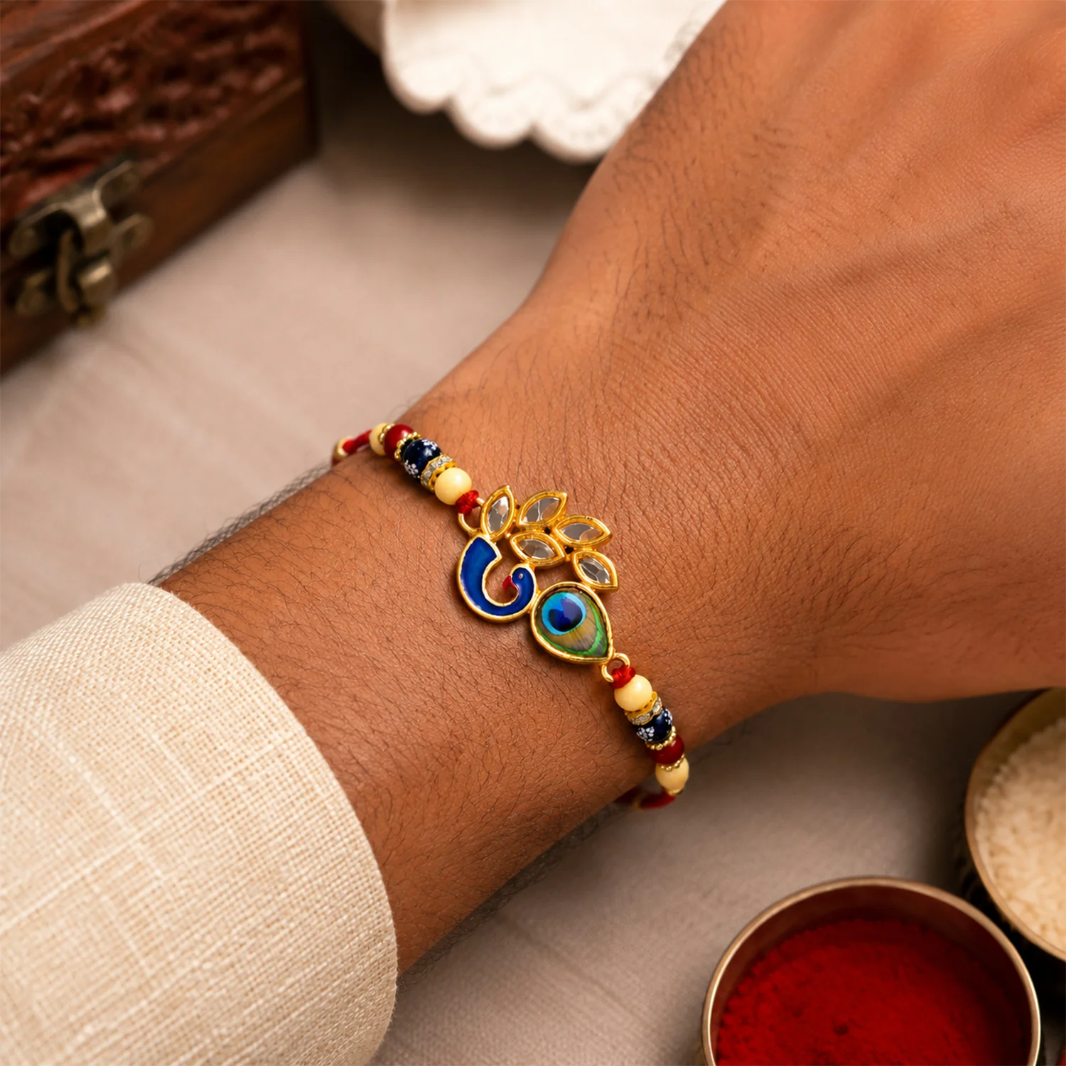 Mor Pankh Rakhi – Artistic Enamel Design with Traditional Thread - Image 2