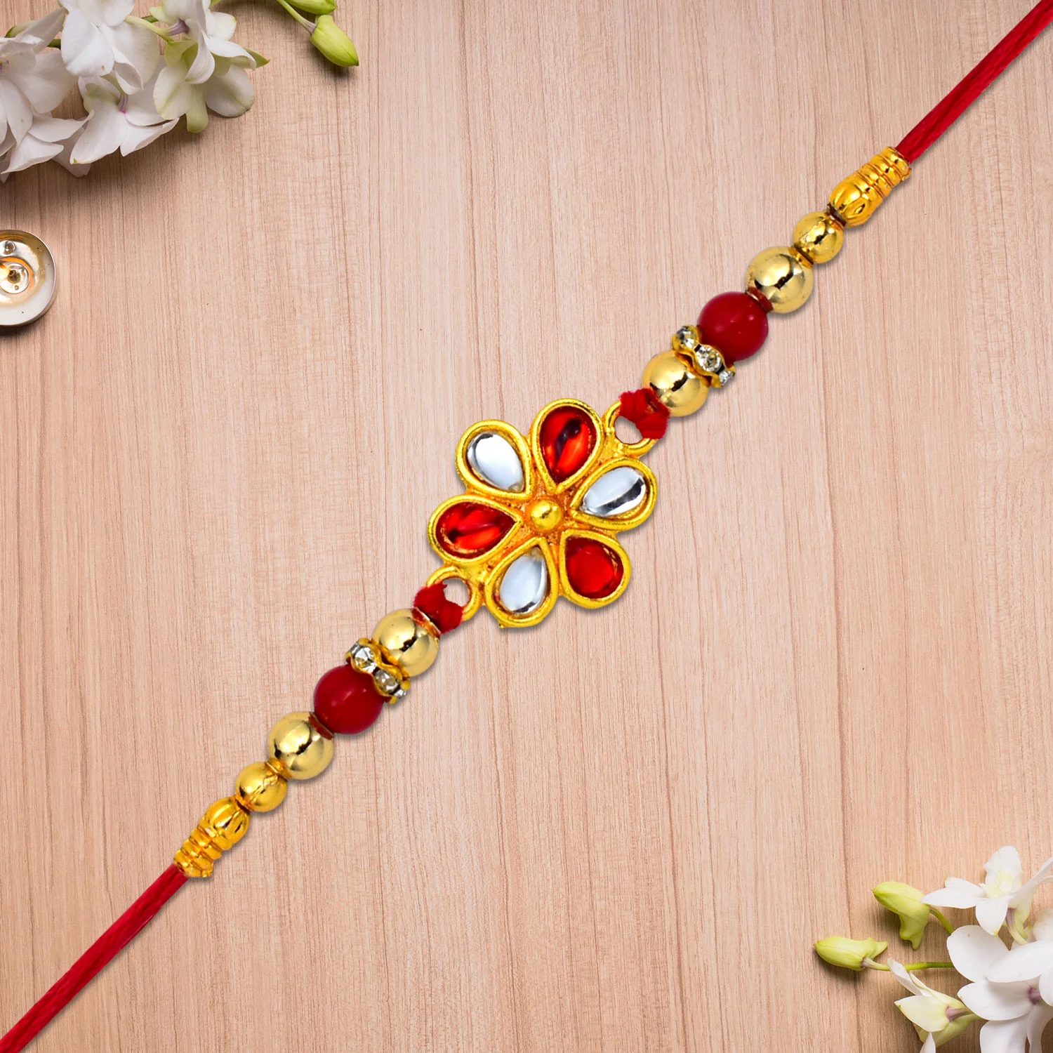 Shop Red White Beaded Rakhi with Kundan Floral Centerpiece - Image 6