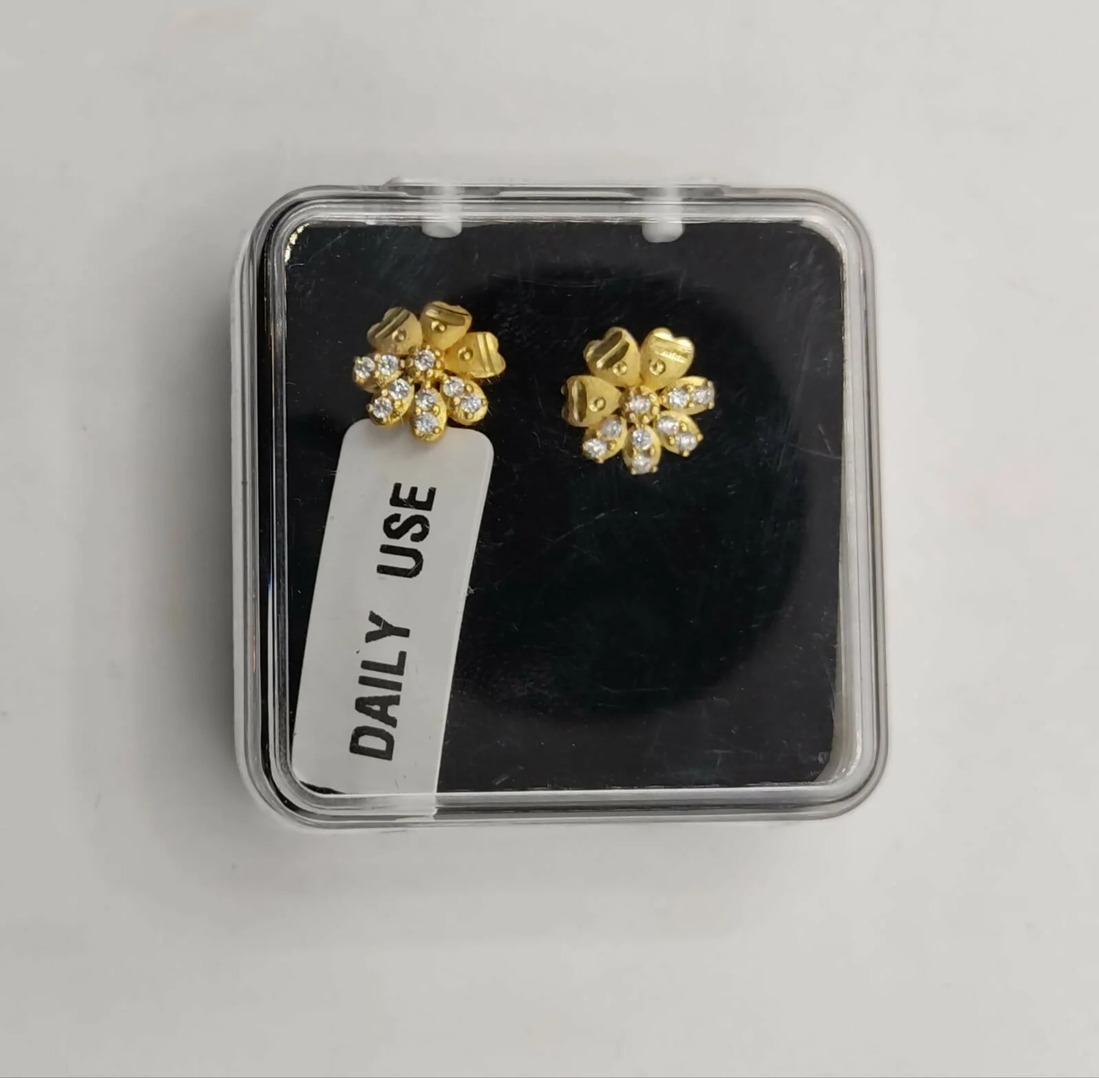 Gold Floral Stud Earrings – Elegant Diamond-Cut Finish - Image 5