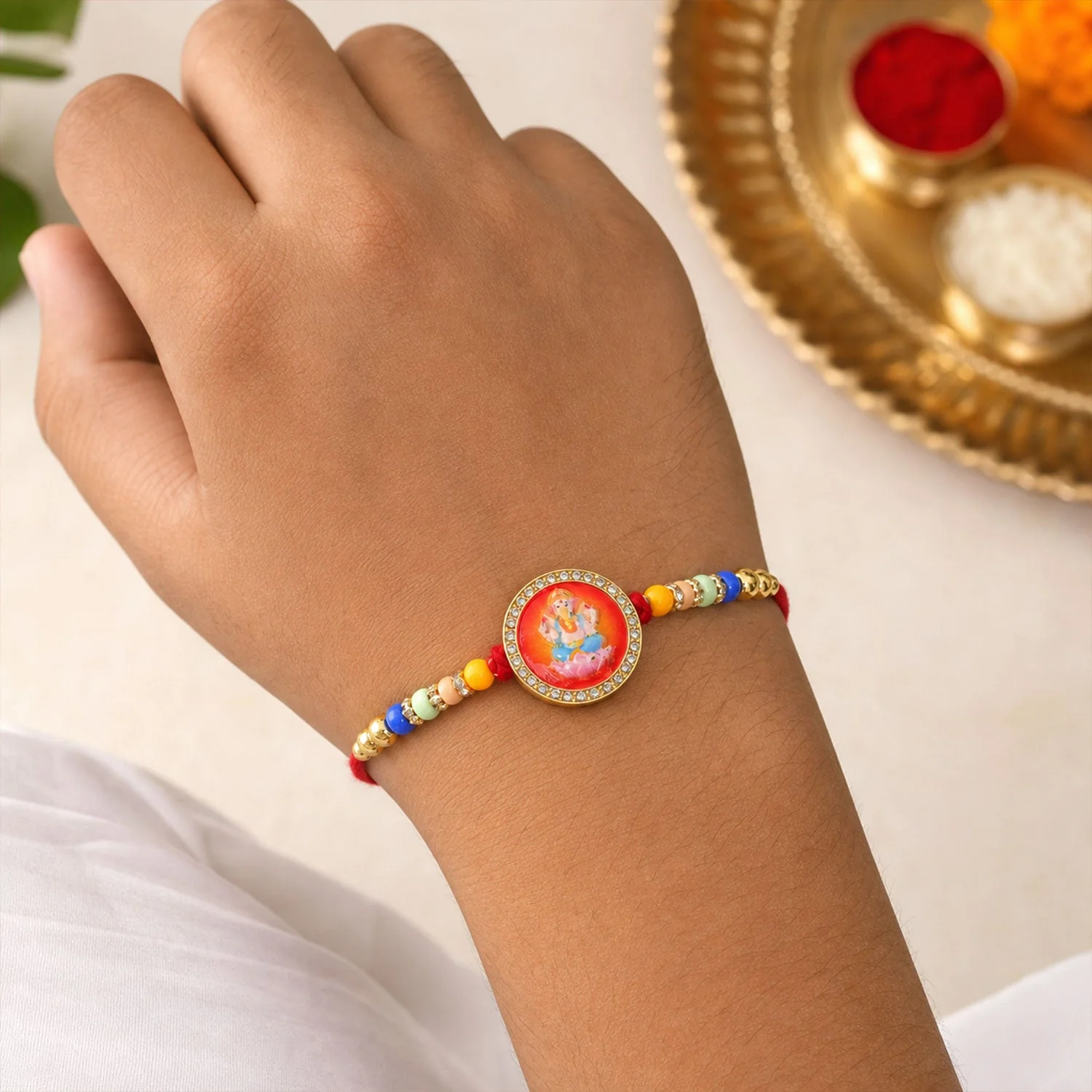 Golden Ganesha Motif Rakhi with Stones & Colorful Beads Rakhi for Brother - Image 2