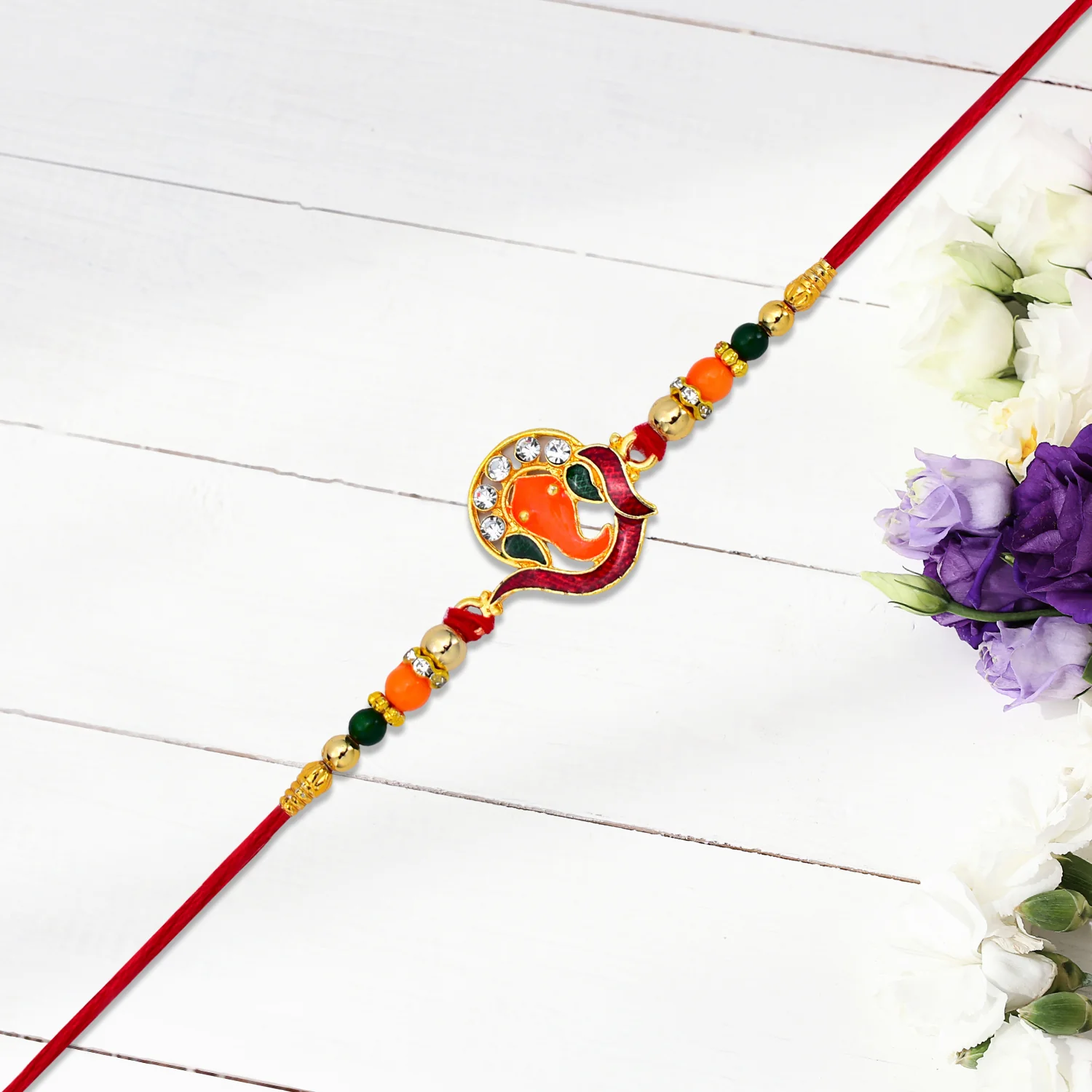 Golden Ganesha Rakhi – Red & Green Beads with Stone Detailing - Image 5