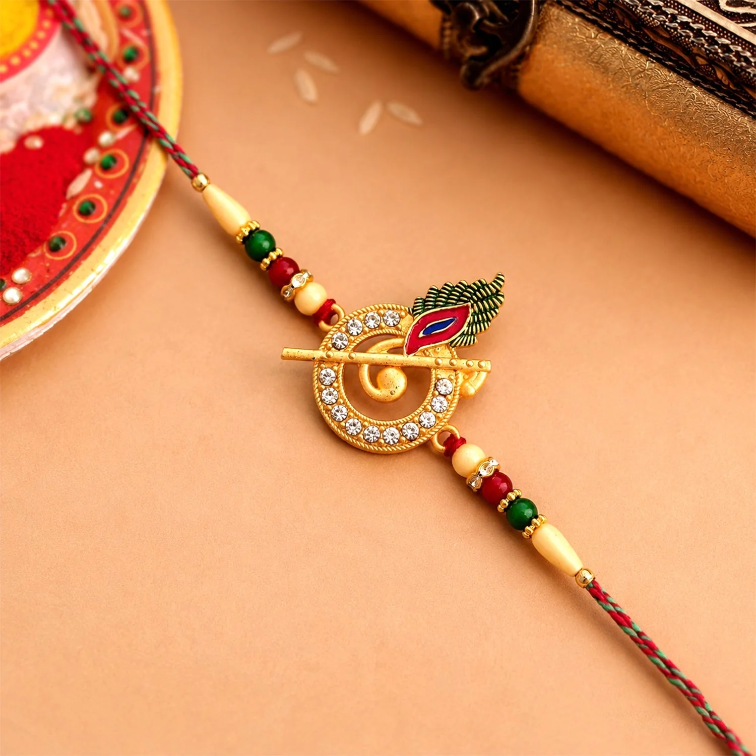 Krishna Flute Rakhi – Stone Studded Peacock Feather Design - Image 2