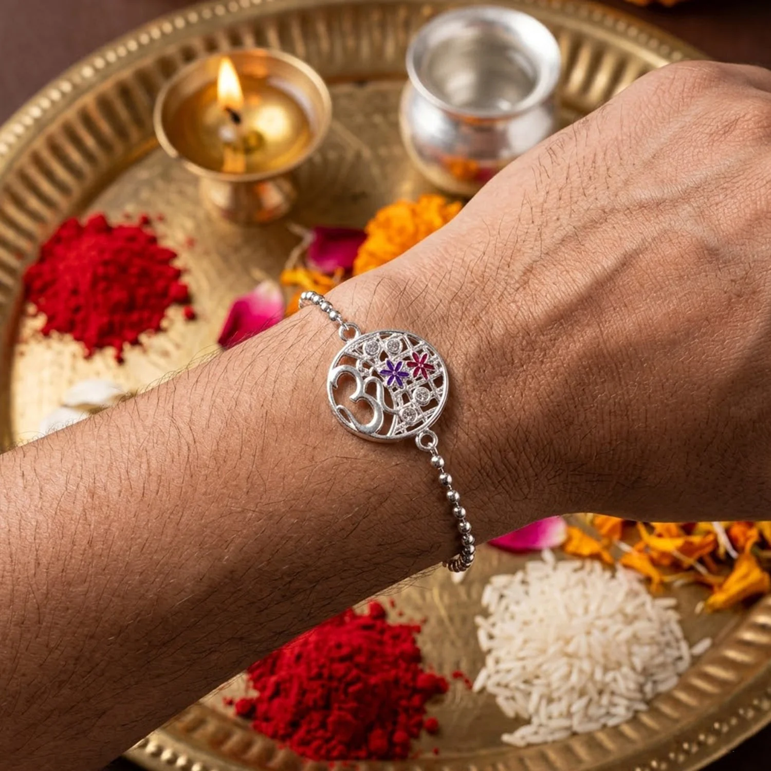 Om Symbol Rakhi – Elegant Floral Design for Brothers and Sisters - Image 2