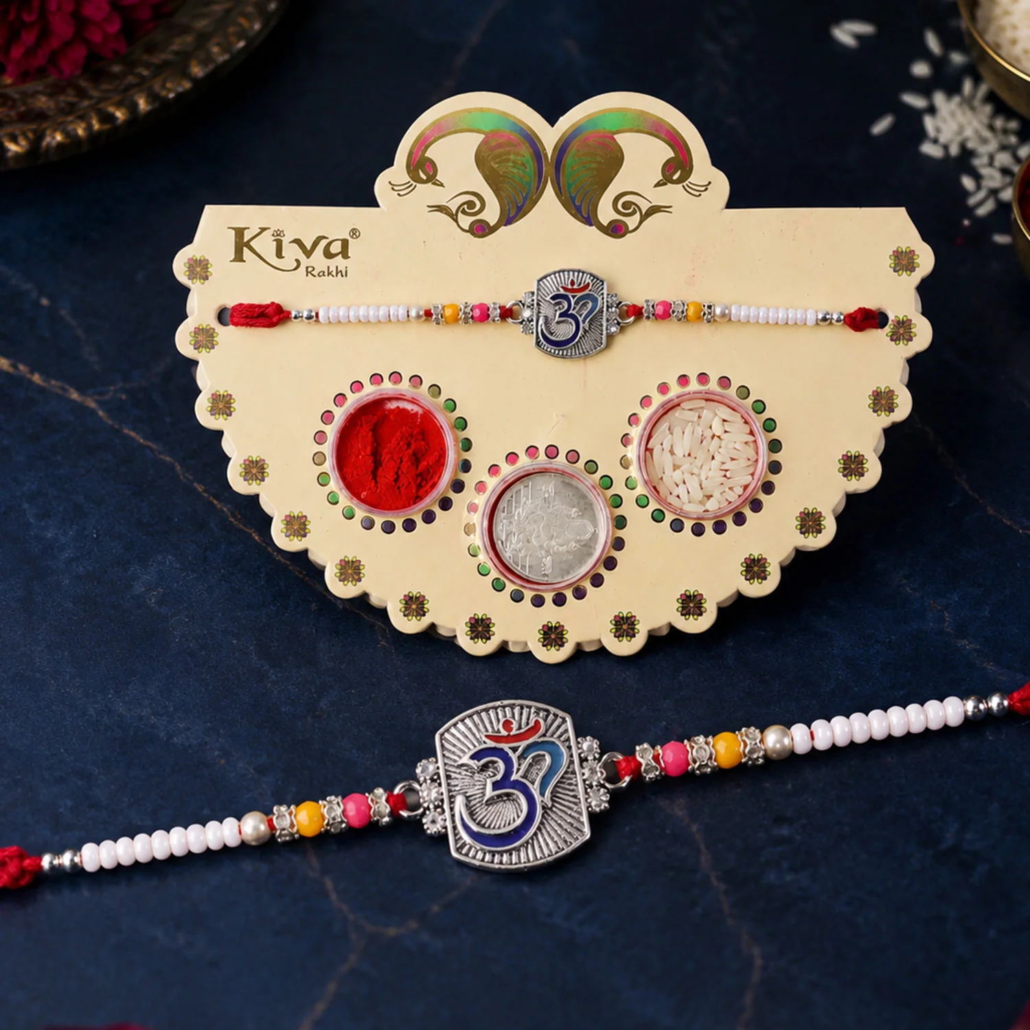 Om Symbol Silver Centre Rakhi with White Beads, Roli Chawal Coin and Peacock Gift Packing - Image 3