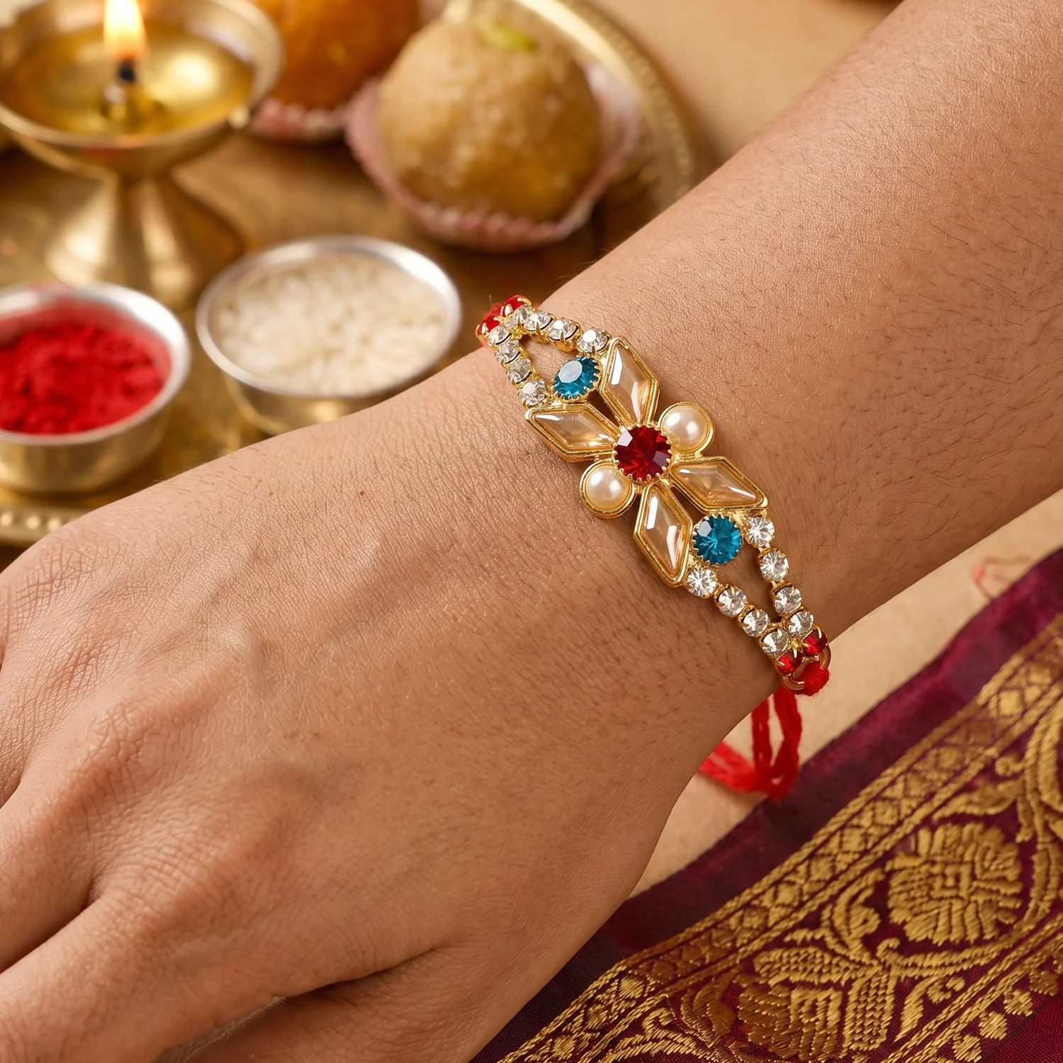 Rakshabandhan Pastel Floral Kundan Rakhi – Elegant Blue Stone & Pearl - Image 3