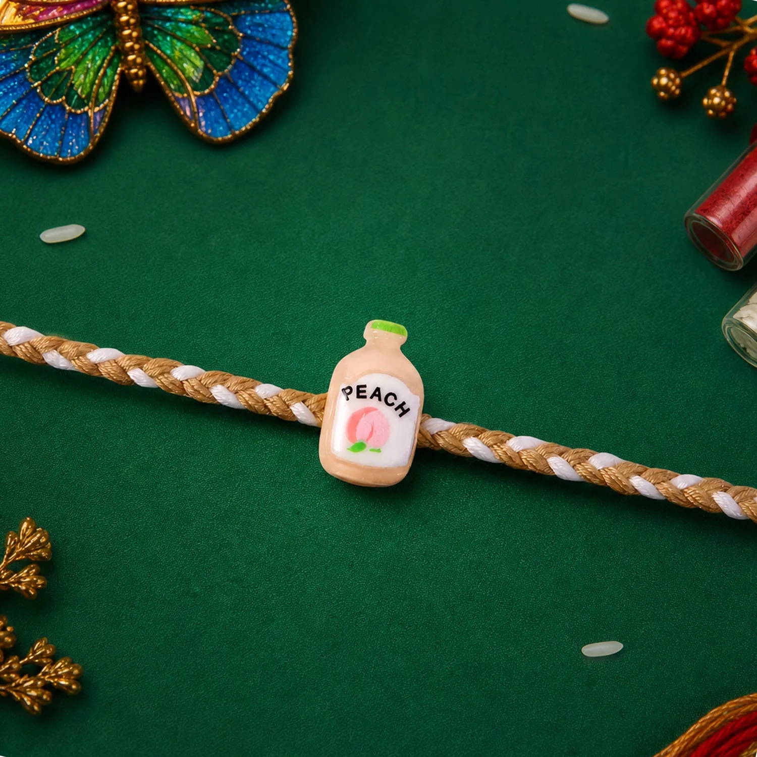 Peach Bottle Charm Rakhi – Elegant Festive Design for Brothers - Image 3
