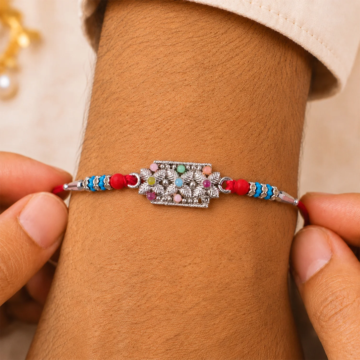Rectangular Pearl Crystal Rakhi with Red Blue Beads, Roli Chawal Coin and Gift Packing - Image 4