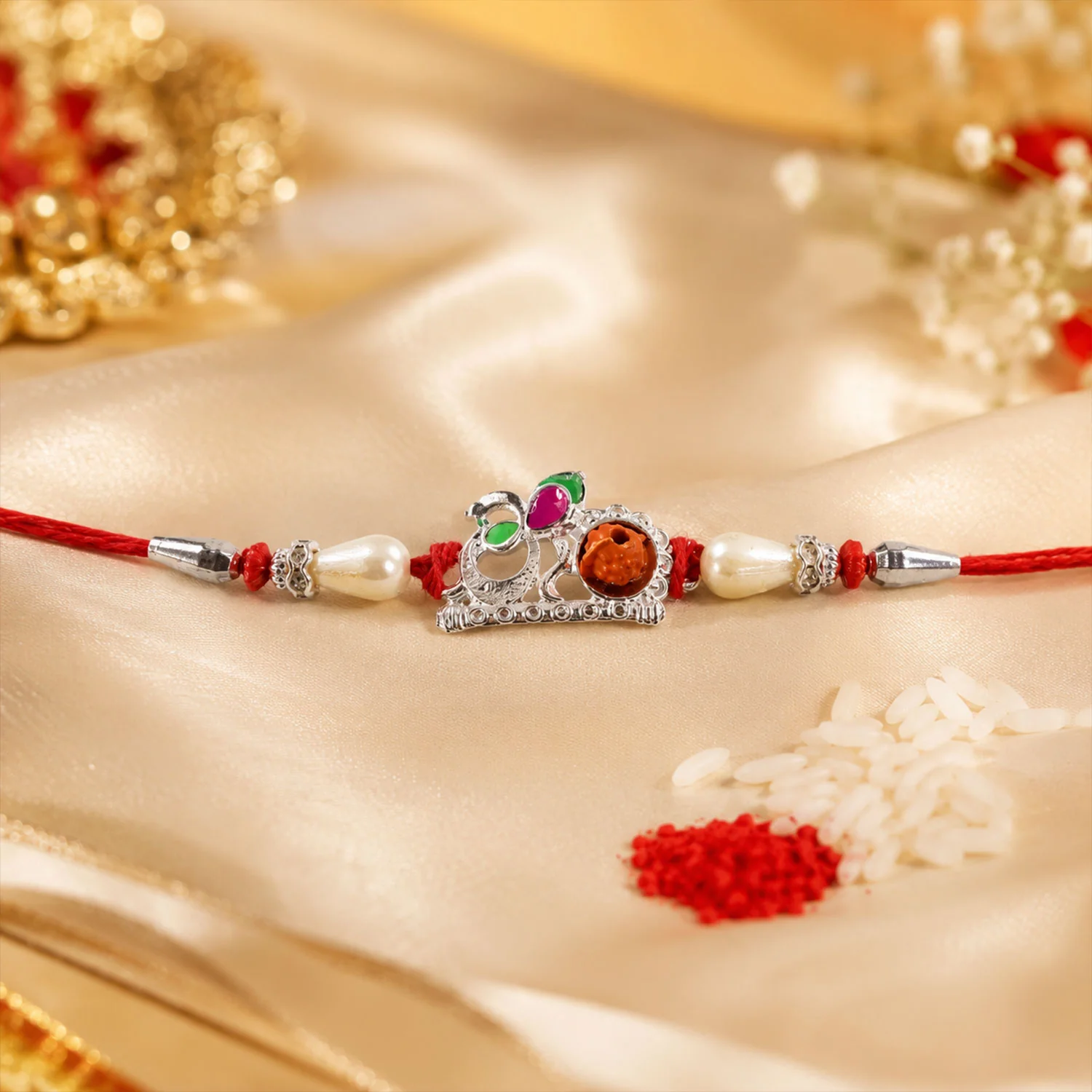 Rakhi – Elegant Red Gold Floral Om with Pearls & Stone - Image 2