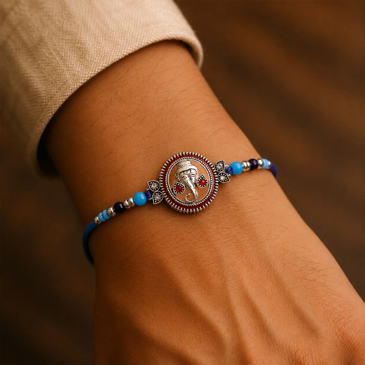 Round Ganesha Medallion Rakhi with Blue Thread, Roli Chawal Coin and Peacock Card Packing - Image 4