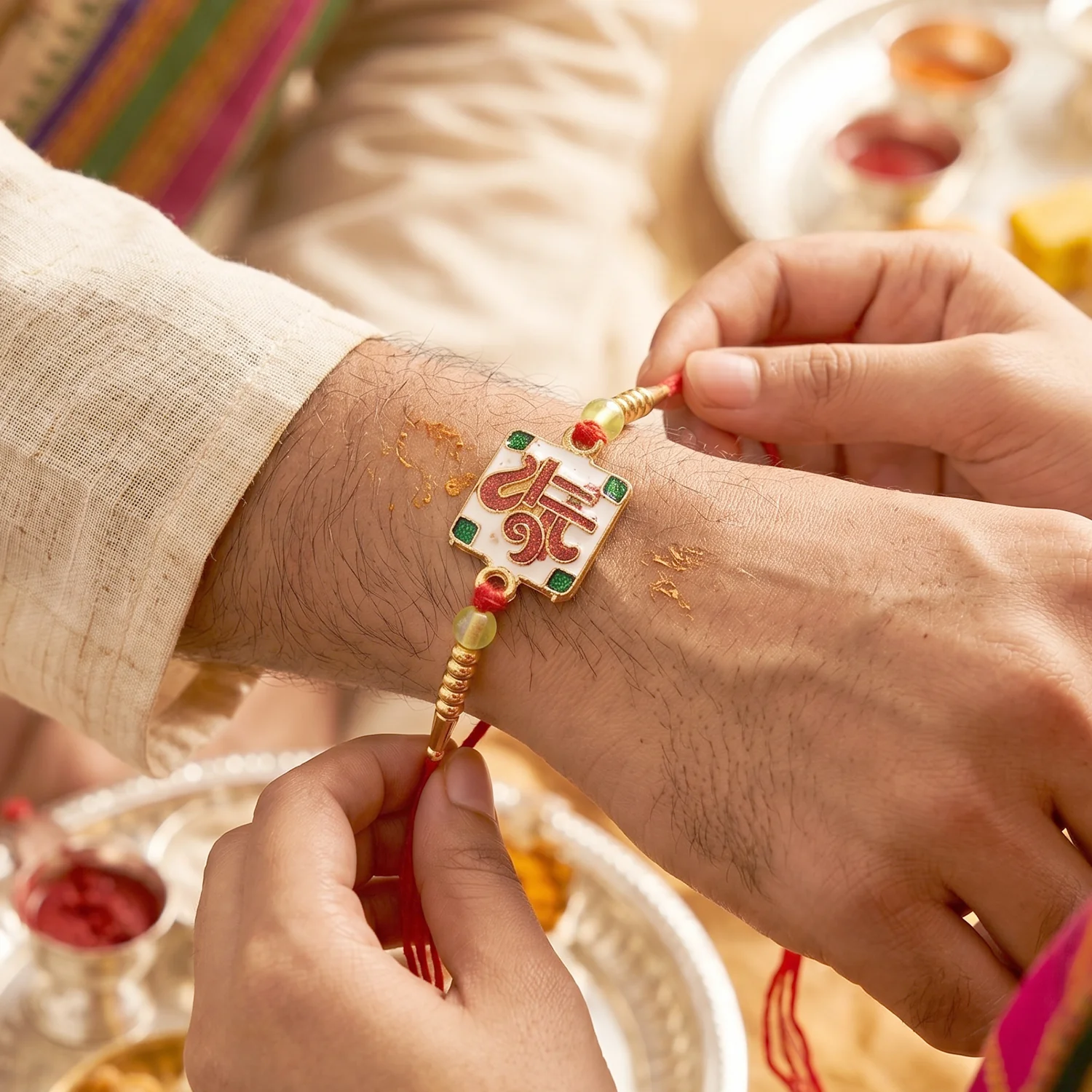 Rakshabandhan Shree Symbol Square Rakhi – Elegant Green Stones & Gold Beads - Image 4