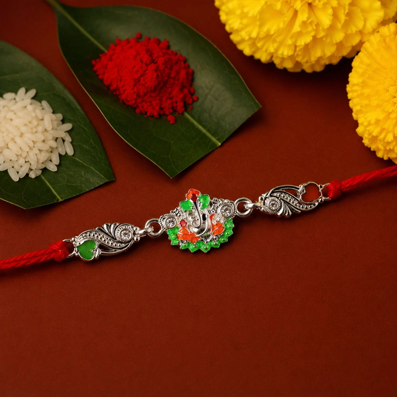Rakhi – Elegant Silver Ganesh Charm with Red Dori for Brother - Image 3