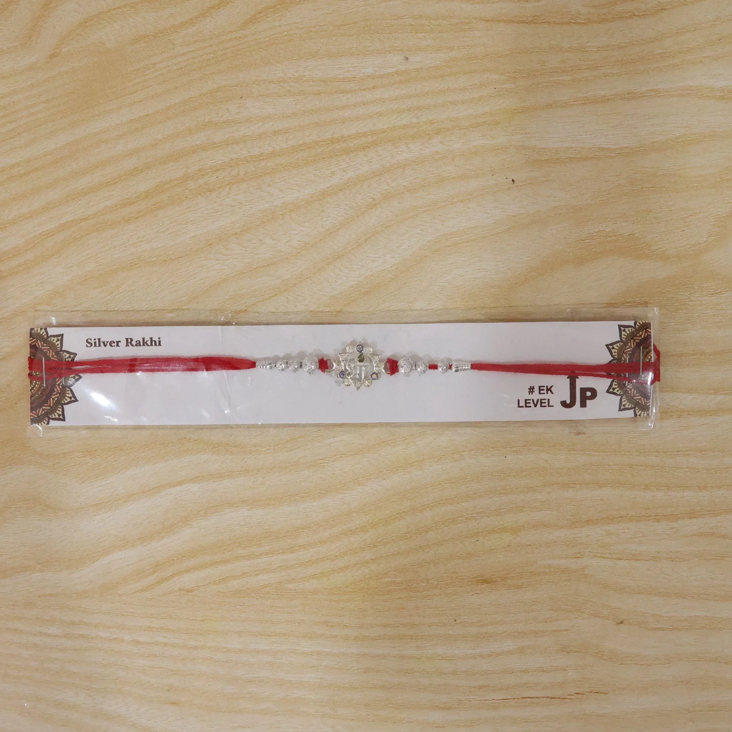 Silver Swastik Rakhi – Elegant Festive Raksha Bandhan Thread - Image 6