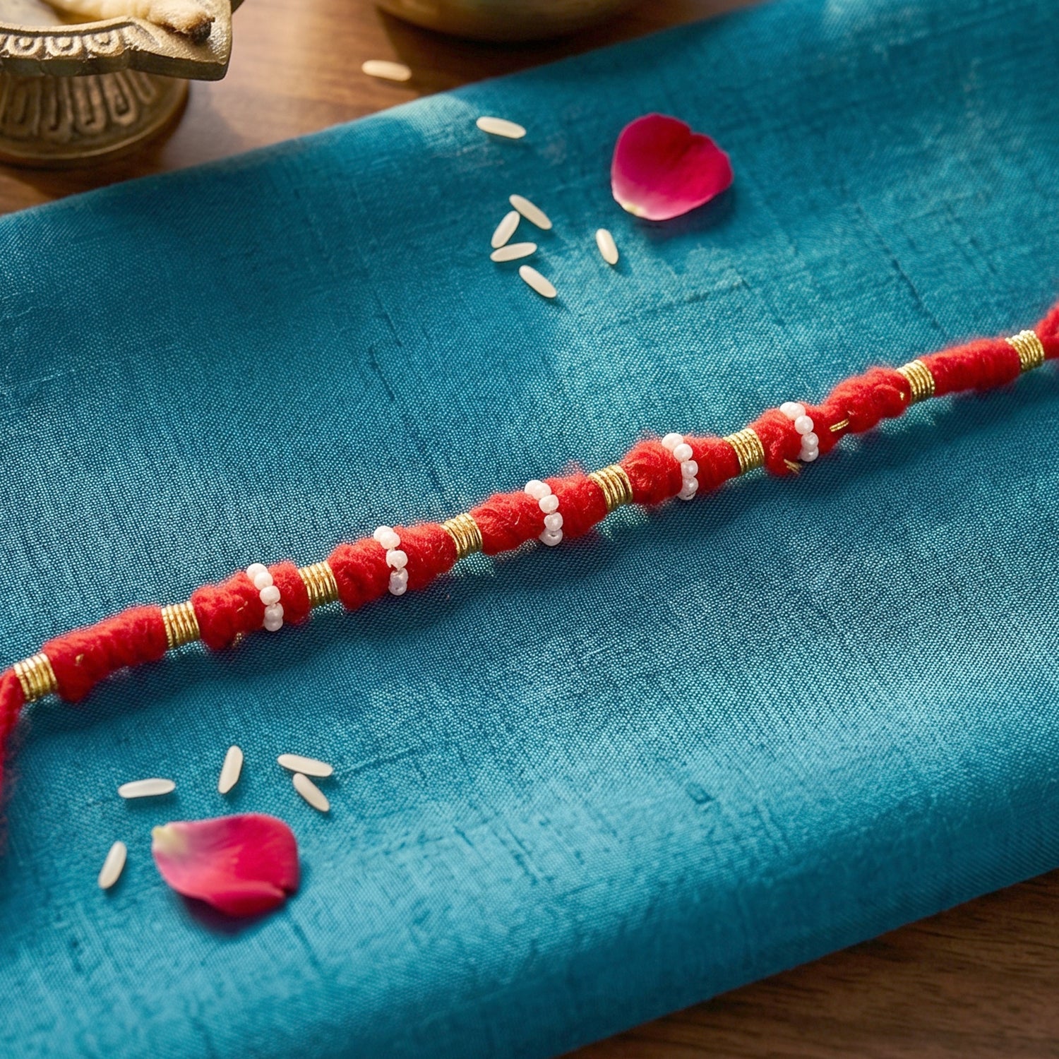 Handmade Red Rakhi with White Beads – Traditional Celebration Accessory - Image 2