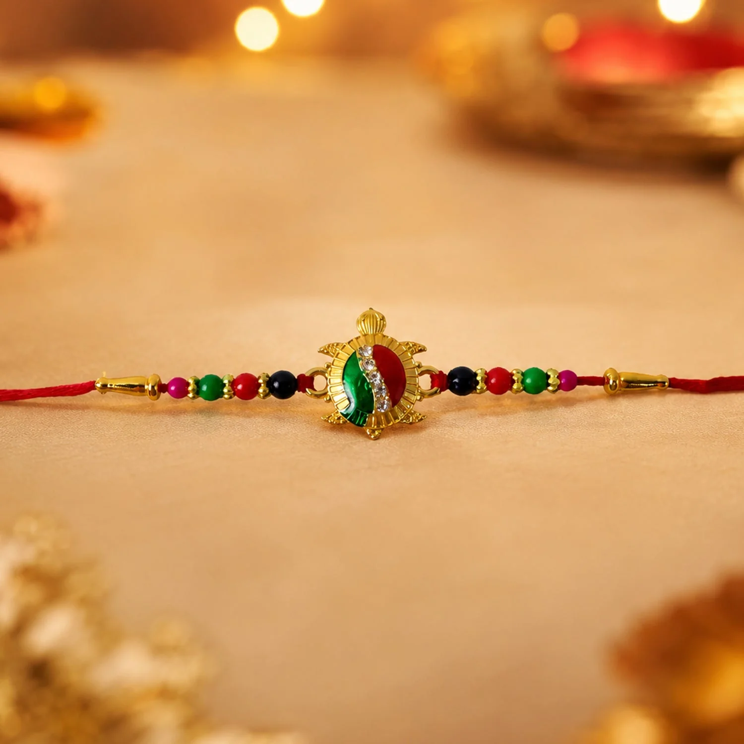 Rakhi – Elegant Turtle Design with Stone Work & Red Thread - Image 4